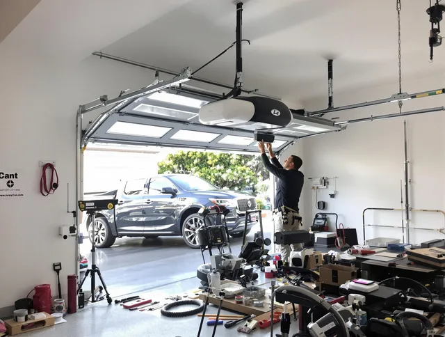 Stafford Garage Door Repair specialist installing smart garage door opener system in Stafford home